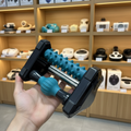 LKL0158 Plantar Fascia Relaxer - Teal relaxation ball close-up between black frame - Showroom