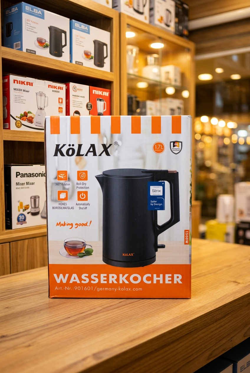 KOLAX matte black kettle held by handle